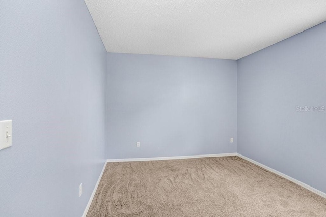 8818 Tottenham Way, Kissimmee, FL 34747 - carpeted spare room featuring baseboards