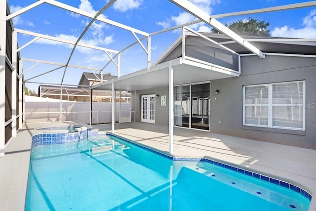 8818 Tottenham Way, Kissimmee, FL 34747 - view of pool with a patio, french doors, a pool with connected hot tub, and glass enclosure