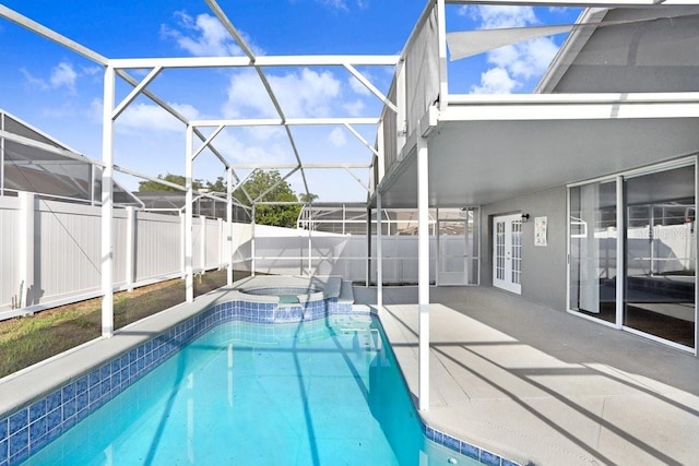 8818 Tottenham Way, Kissimmee, FL 34747 - view of swimming pool featuring french doors, a patio area, a fenced backyard, and a pool with connected hot tub
