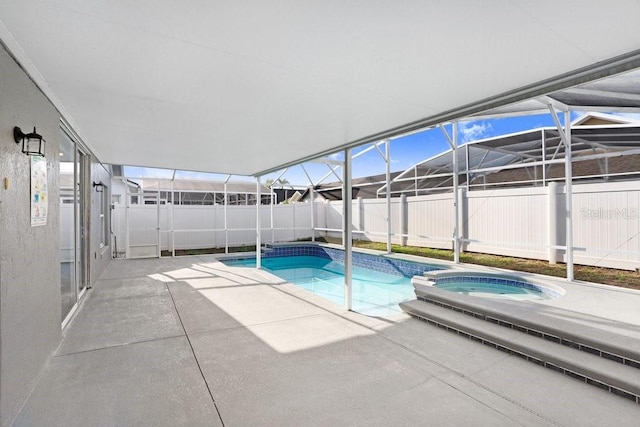 8818 Tottenham Way, Kissimmee, FL 34747 - view of swimming pool with an in-ground hot tub, a patio area, and a lanai