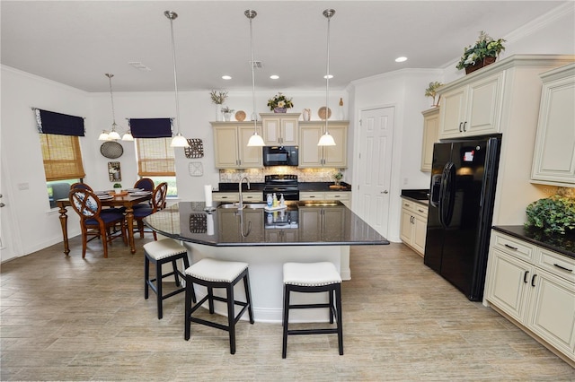 961 Christina Chase Dr, Lakeland, FL 33813 - kitchen featuring black appliances, cream cabinetry, a breakfast bar, backsplash, and recessed lighting