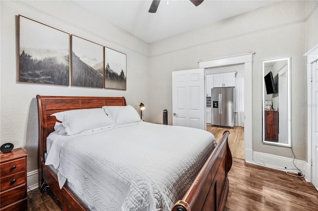 213 Cannon St, Lakeland, FL 33803 - bedroom featuring stainless steel fridge, dark wood-style floors, and ceiling fan