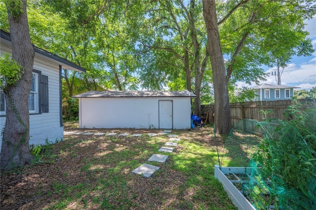 213 Cannon St, Lakeland, FL 33803 - view of yard featuring a storage shed and a vegetable garden