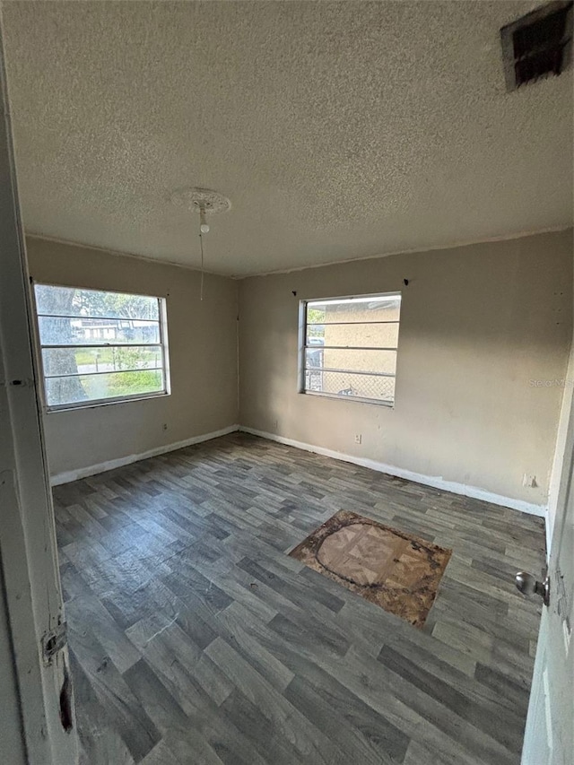 2921 Galaxy Ln, Lakeland, FL 33801 - unfurnished room with wood finished floors and a textured ceiling