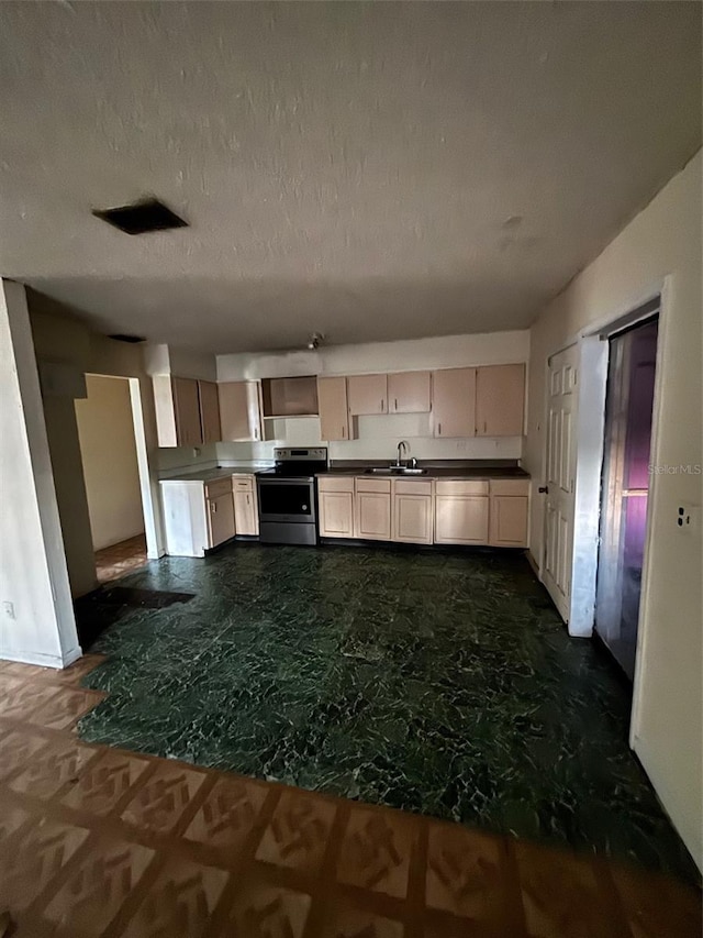 2921 Galaxy Ln, Lakeland, FL 33801 - kitchen with stainless steel electric stove and dark countertops