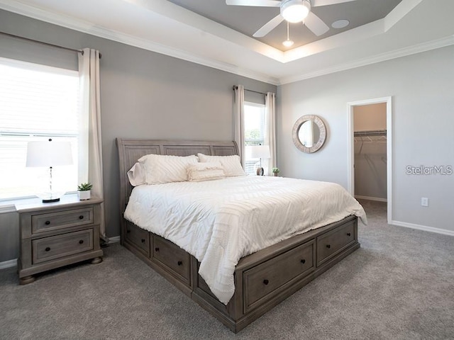1449 Fleur Dr, Davenport, FL 33837 - bedroom with a raised ceiling, carpet floors, a spacious closet, crown molding, and ceiling fan
