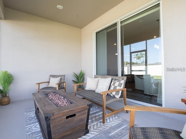 1449 Fleur Dr, Davenport, FL 33837 - view of patio with an outdoor fire pit