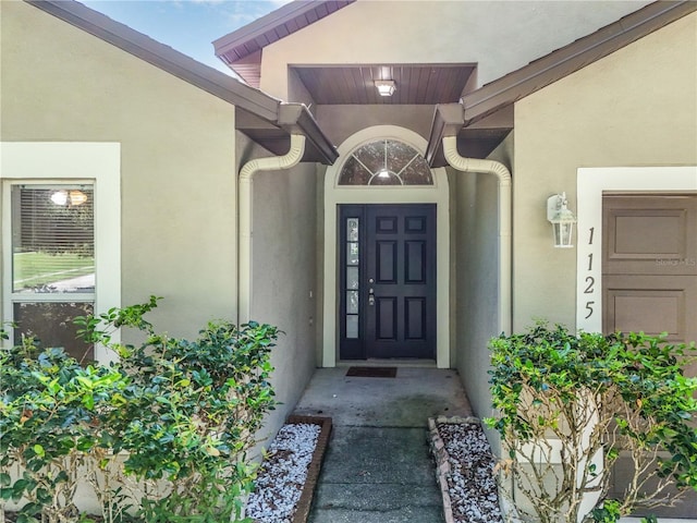 1125 Blackjack Ridge St, Minneola, FL 34715 - doorway to property with stucco siding