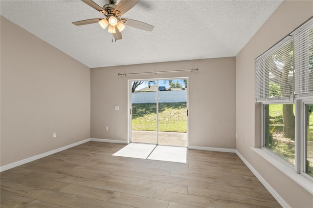 1125 Blackjack Ridge St, Minneola, FL 34715 - spare room featuring a textured ceiling, light wood finished floors, and ceiling fan