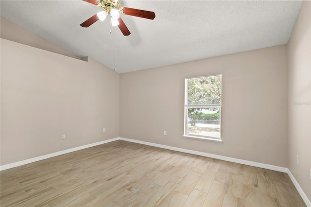 1125 Blackjack Ridge St, Minneola, FL 34715 - spare room featuring a ceiling fan, light wood-style flooring, lofted ceiling, and a textured ceiling