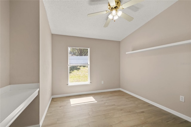1125 Blackjack Ridge St, Minneola, FL 34715 - spare room featuring wood finished floors, a textured ceiling, ceiling fan, and lofted ceiling