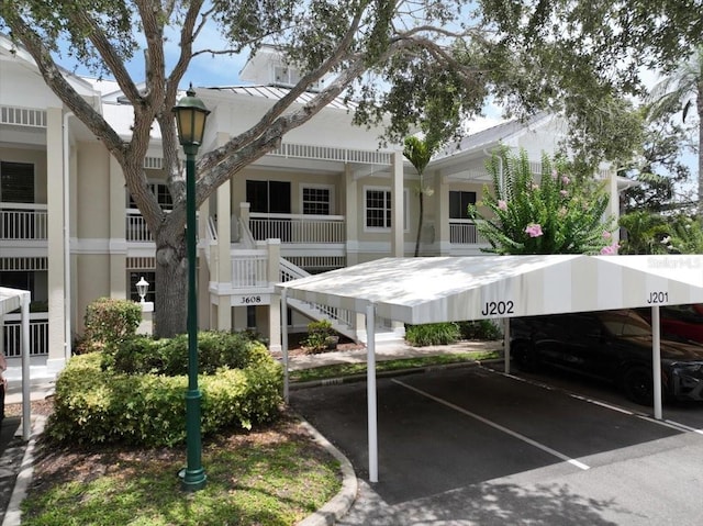 3608 54th Dr W Unit 202, Bradenton, FL 34210 - view of building exterior with covered parking