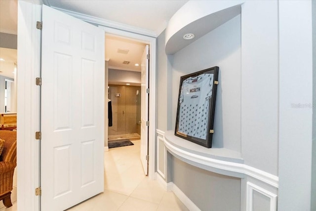 3608 54th Dr W Unit 202, Bradenton, FL 34210 - hall with light tile patterned flooring and crown molding