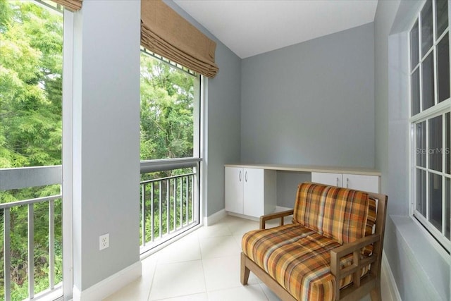 3608 54th Dr W Unit 202, Bradenton, FL 34210 - sitting room featuring light tile patterned floors and baseboards