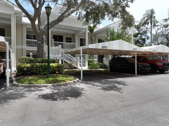 3608 54th Dr W Unit 202, Bradenton, FL 34210 - view of property with covered parking