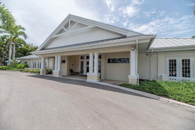 3608 54th Dr W Unit 202, Bradenton, FL 34210 - view of front of property featuring a standing seam roof, a metal roof, and an attached garage