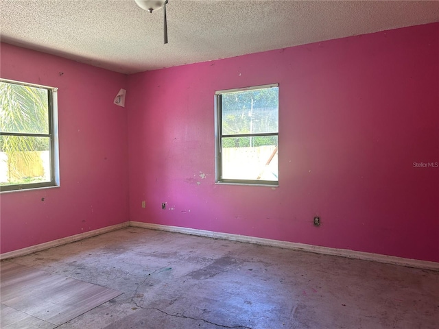 2250 Maple Hill Dr, Lakeland, FL 33811 - empty room featuring unfinished concrete floors and a textured ceiling