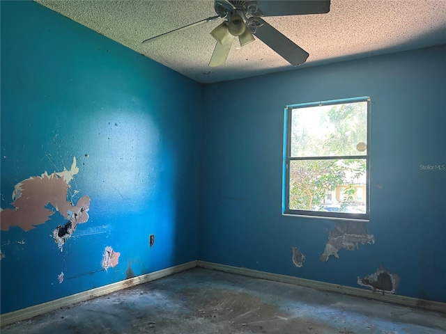 2250 Maple Hill Dr, Lakeland, FL 33811 - unfurnished room with concrete floors, a textured ceiling, and ceiling fan