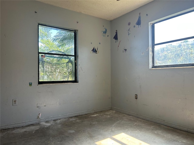2250 Maple Hill Dr, Lakeland, FL 33811 - unfurnished room featuring unfinished concrete flooring and a textured ceiling