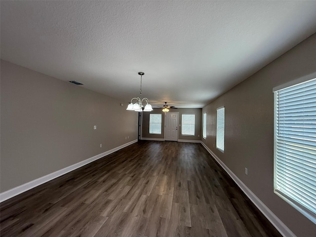 4042 Old Bartow Eagle Lake Rd, Bartow, FL 33830 - unfurnished room with dark wood finished floors, a chandelier, a textured ceiling, and ceiling fan