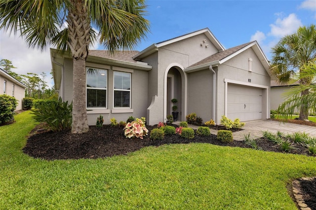 180 Azure Mist Way, Daytona Beach, FL 32124 - view of front facade featuring stucco siding, an attached garage, a front yard, driveway, and a shingled roof