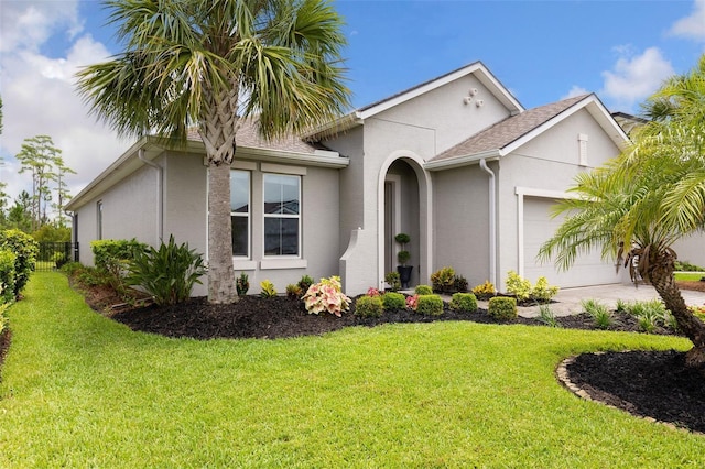 180 Azure Mist Way, Daytona Beach, FL 32124 - view of front of property featuring a garage, stucco siding, and concrete driveway