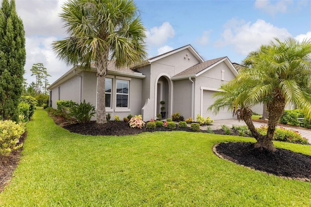 180 Azure Mist Way, Daytona Beach, FL 32124 - view of front facade with stucco siding, a garage, a front lawn, and concrete driveway