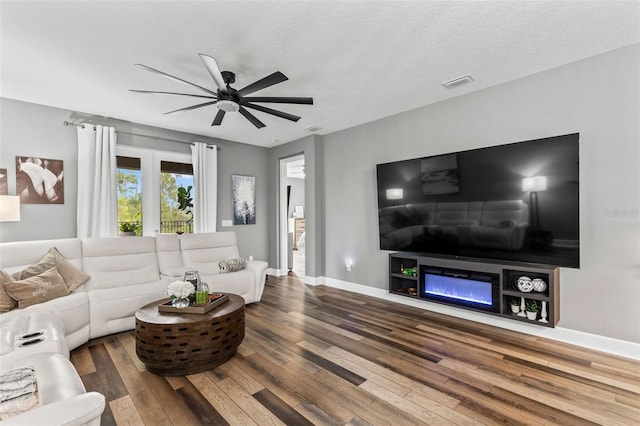 180 Azure Mist Way, Daytona Beach, FL 32124 - living room featuring hardwood / wood-style floors, ceiling fan, and a glass covered fireplace