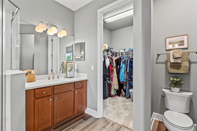 180 Azure Mist Way, Daytona Beach, FL 32124 - full bath with vanity, wood finished floors, a walk in closet, and a shower