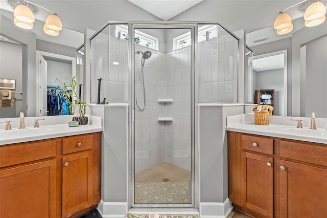 180 Azure Mist Way, Daytona Beach, FL 32124 - bathroom featuring vanity, a shower stall, and a spacious closet