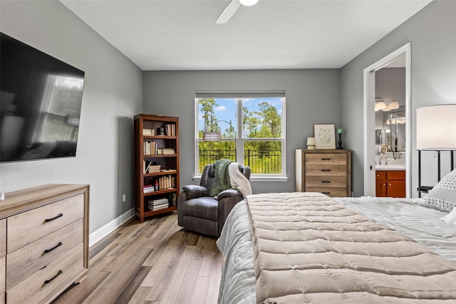 180 Azure Mist Way, Daytona Beach, FL 32124 - bedroom with wood finished floors, ensuite bathroom, and a ceiling fan