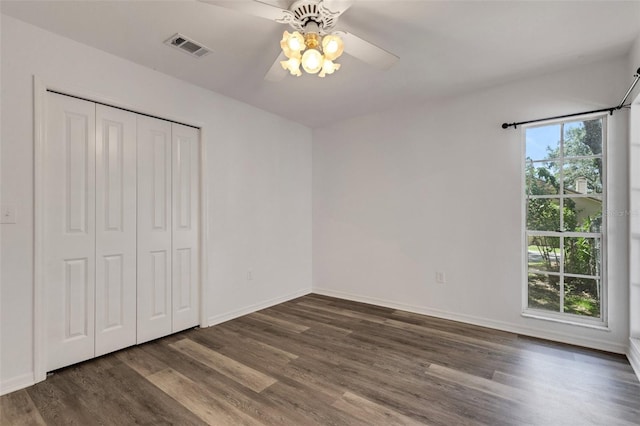 5722 Antler Trl, Lakeland, FL 33811 - unfurnished bedroom with wood finished floors, a closet, and ceiling fan