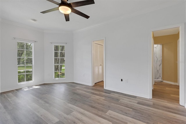 5722 Antler Trl, Lakeland, FL 33811 - unfurnished room featuring a ceiling fan, wood finished floors, and ornamental molding