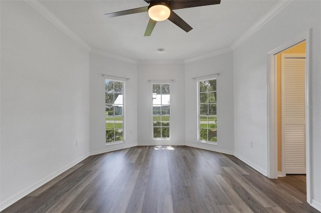 5722 Antler Trl, Lakeland, FL 33811 - unfurnished room featuring healthy amount of natural light, dark wood finished floors, a ceiling fan, and ornamental molding