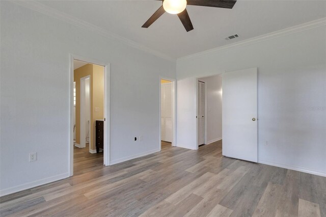 5722 Antler Trl, Lakeland, FL 33811 - unfurnished bedroom featuring crown molding, light wood-type flooring, and a ceiling fan