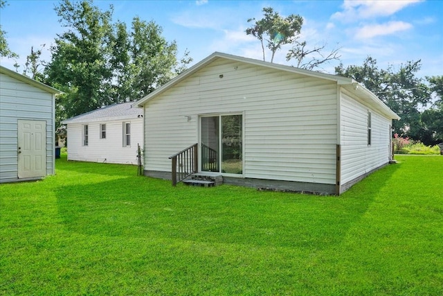 405 S 7th Ave, Bartow, FL 33830 - rear view of property with a yard