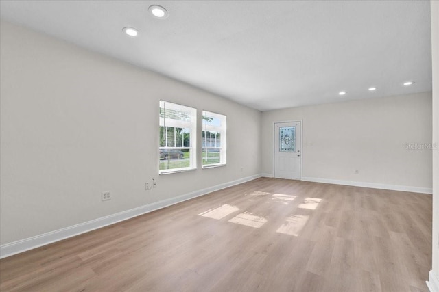 405 S 7th Ave, Bartow, FL 33830 - empty room with light wood-style floors and recessed lighting