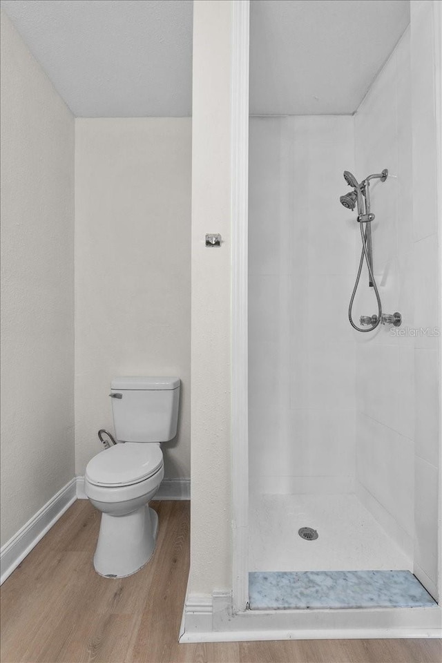405 S 7th Ave, Bartow, FL 33830 - full bathroom featuring a stall shower and wood finished floors