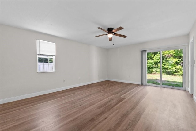 405 S 7th Ave, Bartow, FL 33830 - unfurnished room with plenty of natural light, a ceiling fan, and light wood-style floors