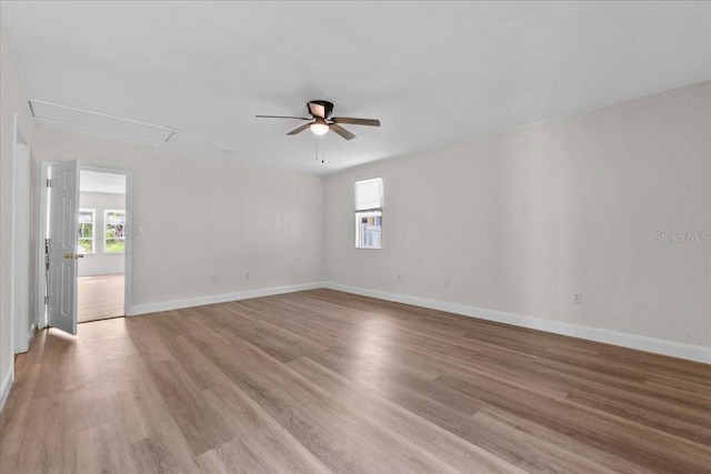 405 S 7th Ave, Bartow, FL 33830 - unfurnished room with attic access, light wood-type flooring, and ceiling fan