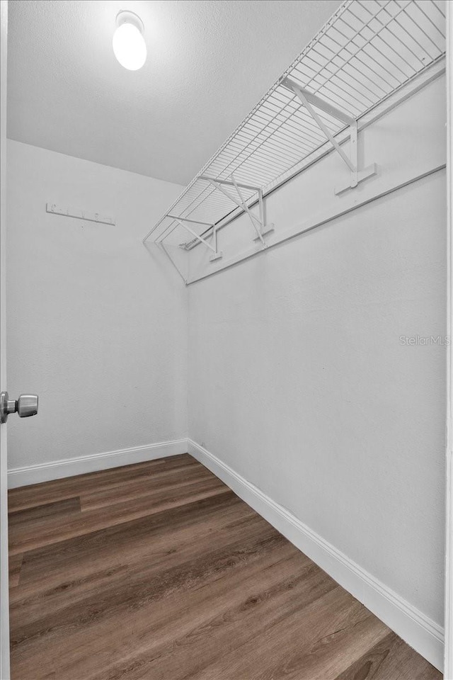 405 S 7th Ave, Bartow, FL 33830 - walk in closet with dark wood-style floors