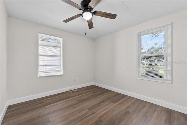 405 S 7th Ave, Bartow, FL 33830 - unfurnished room with healthy amount of natural light, dark wood-style floors, and a ceiling fan