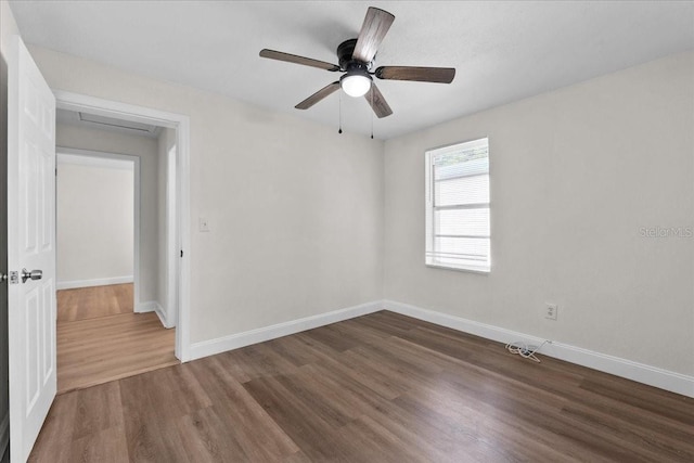 405 S 7th Ave, Bartow, FL 33830 - spare room with wood finished floors, a ceiling fan, and attic access