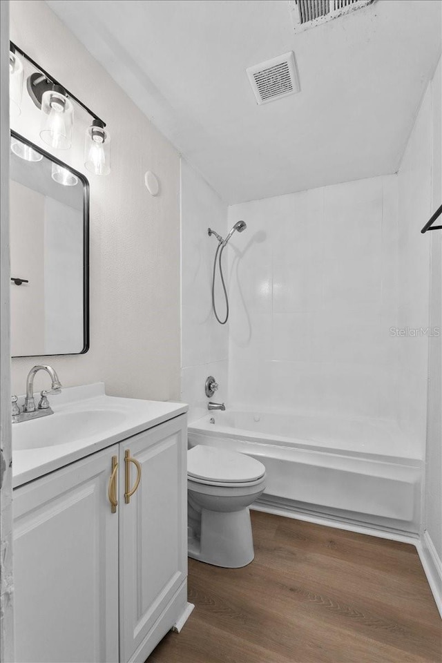 405 S 7th Ave, Bartow, FL 33830 - full bathroom with vanity, shower / washtub combination, and wood finished floors