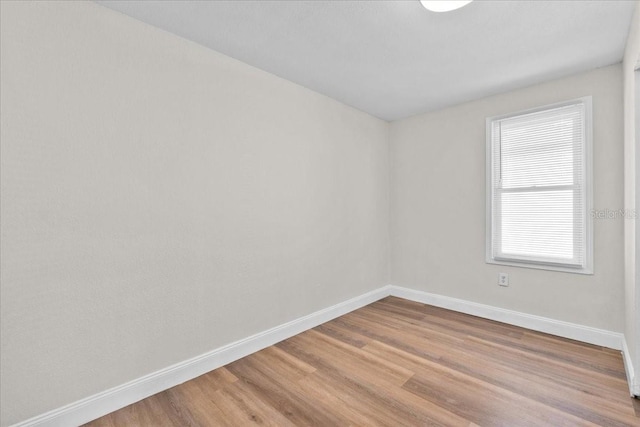 405 S 7th Ave, Bartow, FL 33830 - empty room with baseboards and light wood finished floors