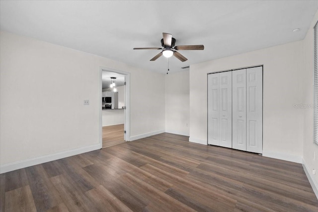 405 S 7th Ave, Bartow, FL 33830 - unfurnished bedroom with wood finished floors, a closet, and a ceiling fan