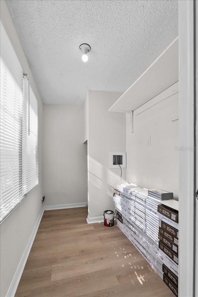 405 S 7th Ave, Bartow, FL 33830 - interior space featuring a textured ceiling, wood finished floors, and washer hookup