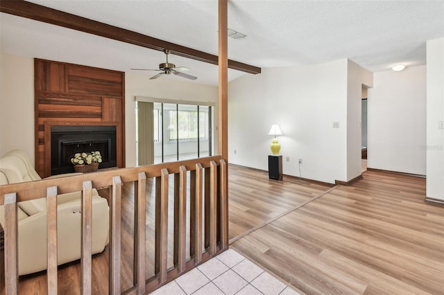 849 Rockingham Rd, Lakeland, FL 33809 - living area with ceiling fan, a fireplace, wood finished floors, and a textured ceiling