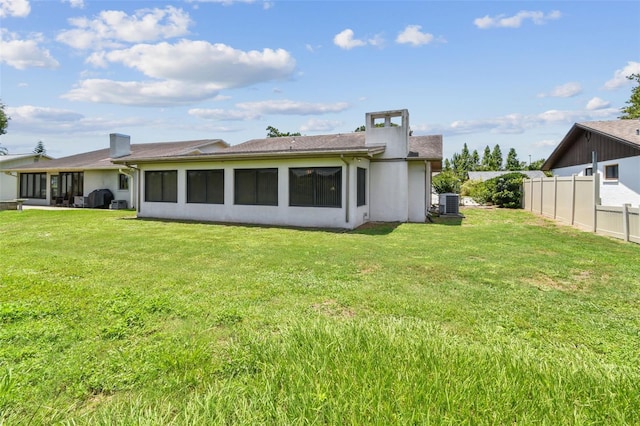 849 Rockingham Rd, Lakeland, FL 33809 - back of property featuring stucco siding and a chimney