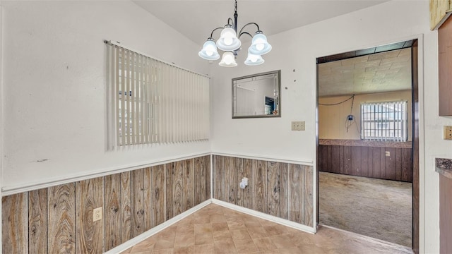 640 Forrest Dr, Bartow, FL 33830 - unfurnished dining area with a chandelier, a wainscoted wall, and wooden walls